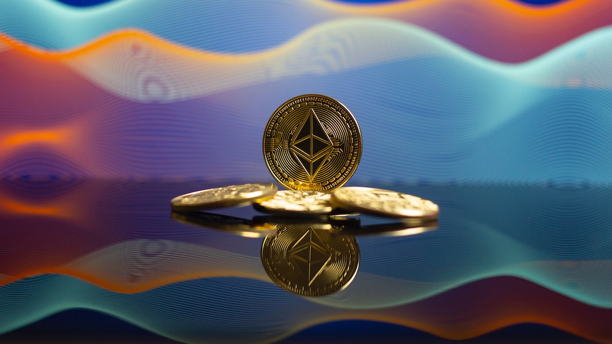 An Ethereum coin on coloured background (ETH). Source: Unsplash