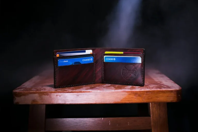 Wallet with debit cards symbolizing the rise of Bitcoin debit cards and crypto rewards options for everyday spending in 2025.