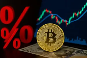 Bitcoin coin on US dollar with stock chart background after Fed rate cut showing crypto inflows and market reaction.