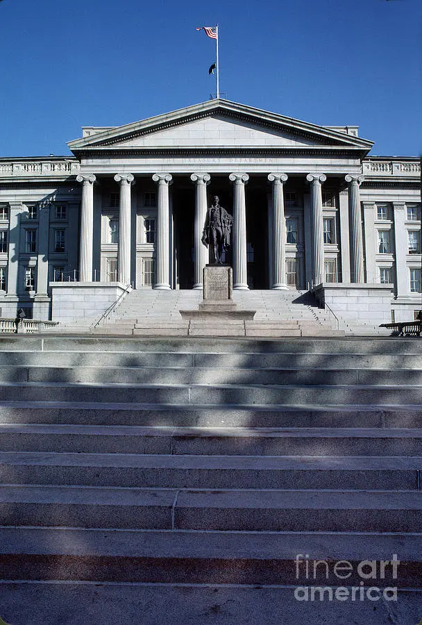 United States Treasury Department building exterior with columns and statue