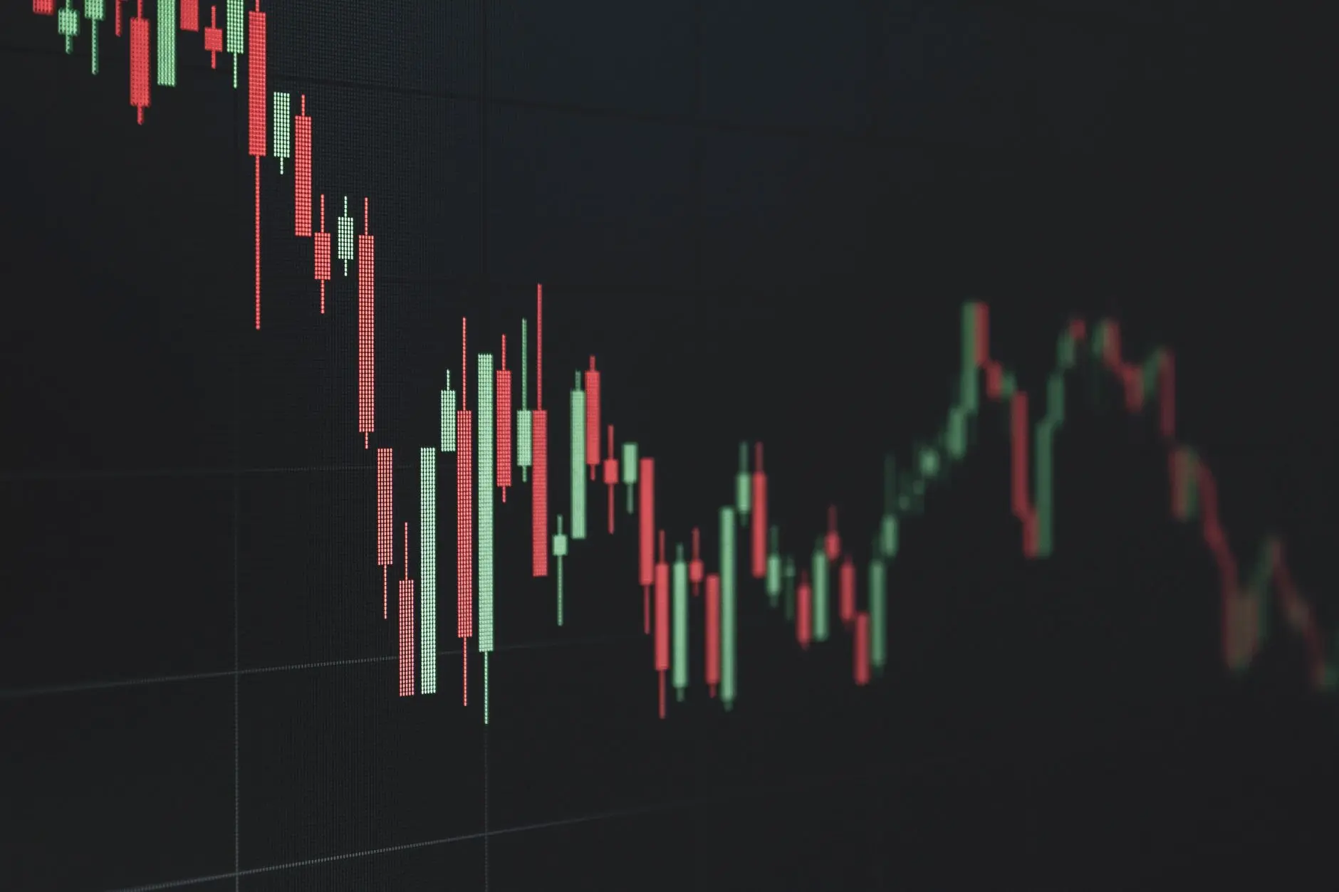 Close-up of a Bitcoin candlestick chart with green and red bars.