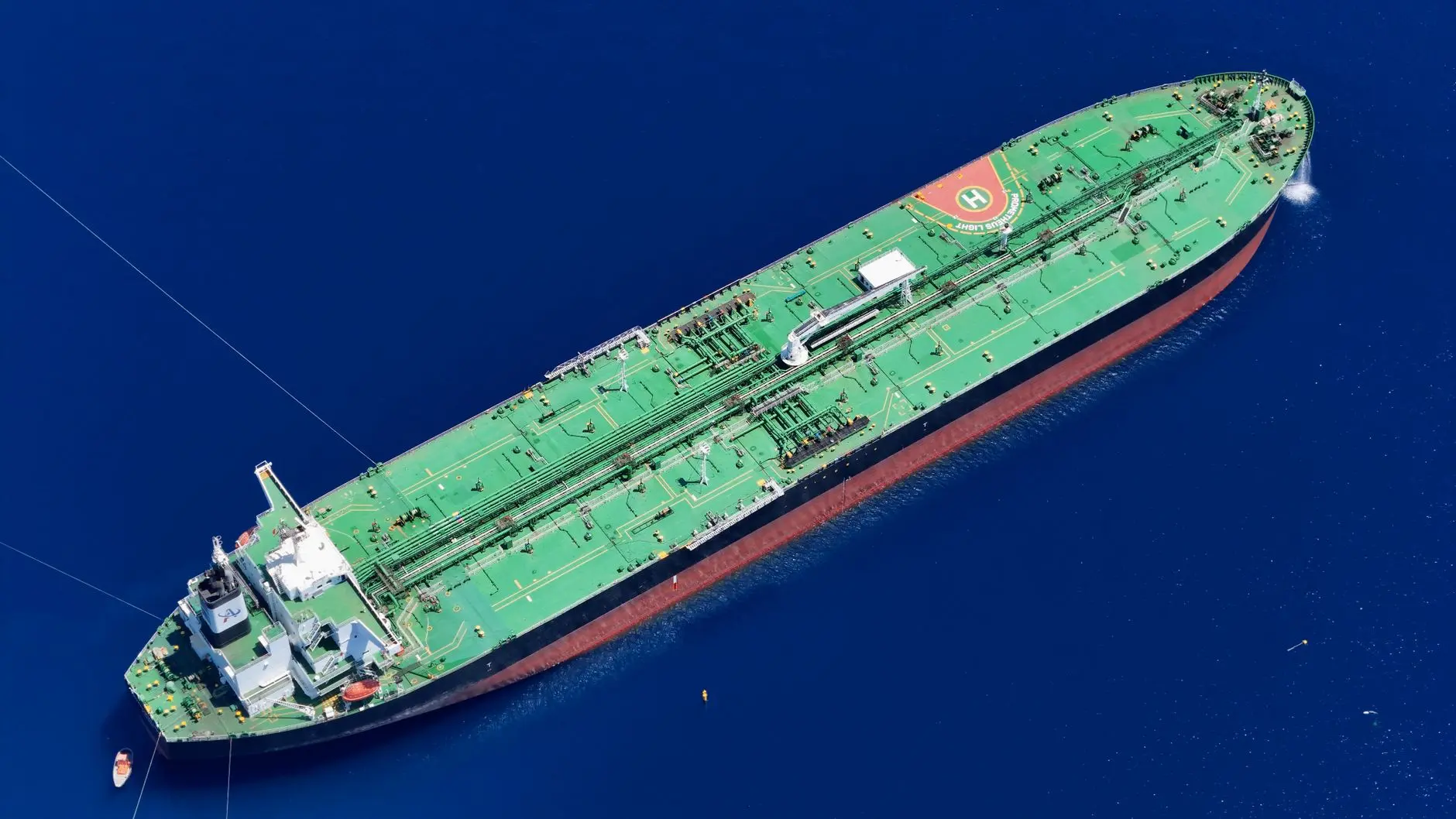 Aerial view of a large crude oil tanker ship at sea.
