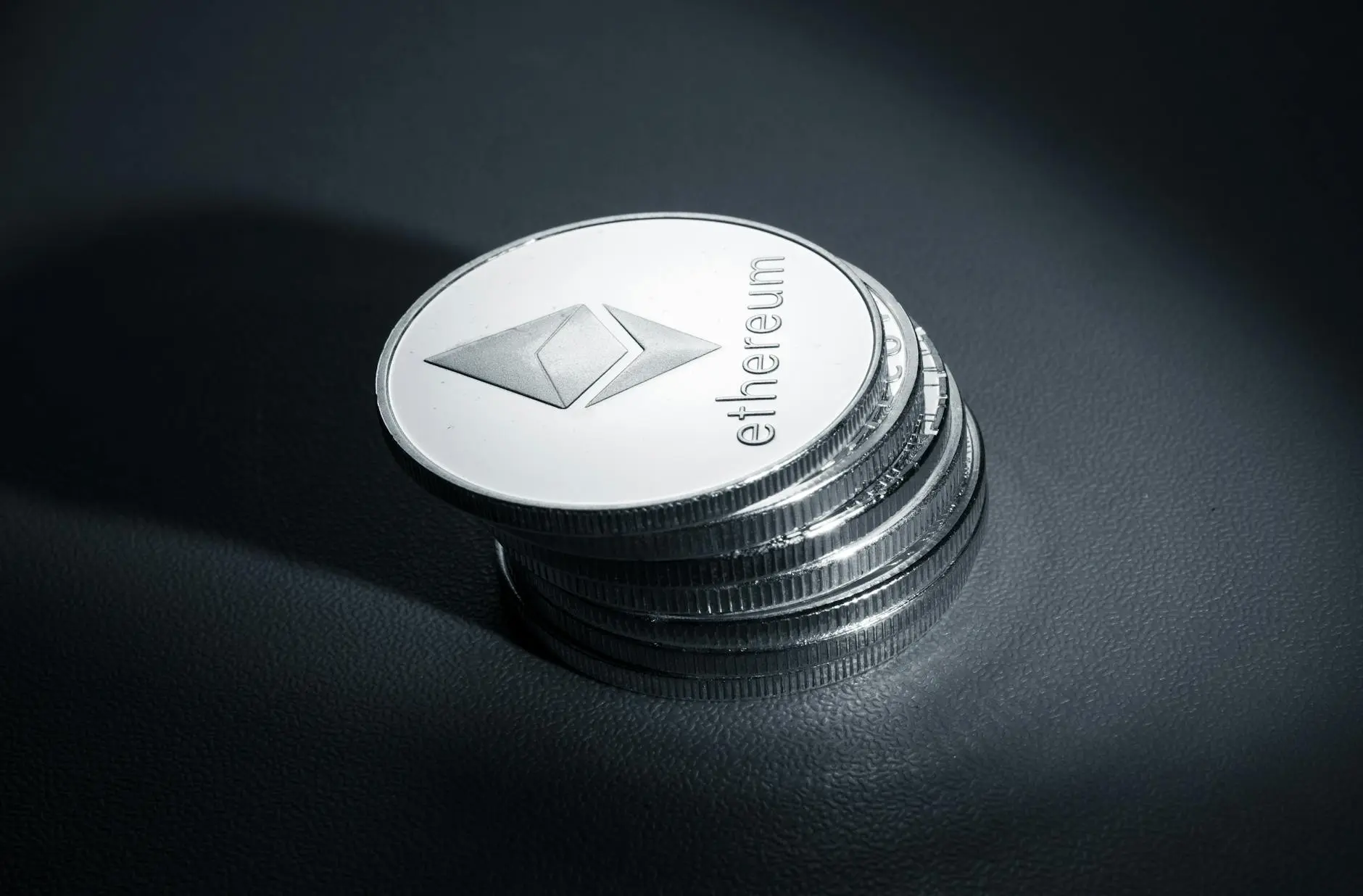 Stack of Ethereum coins with the Ethereum logo visible on top.
