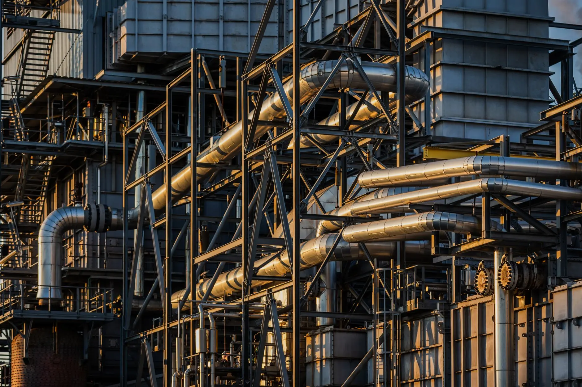 Industrial oil refinery with complex pipes and metal structures