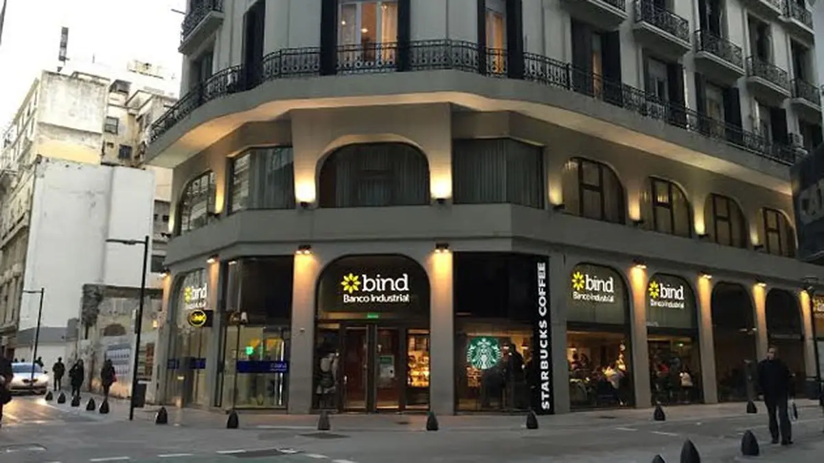 Exterior of BIND Banco Industrial Argentina building with Starbucks nearby.