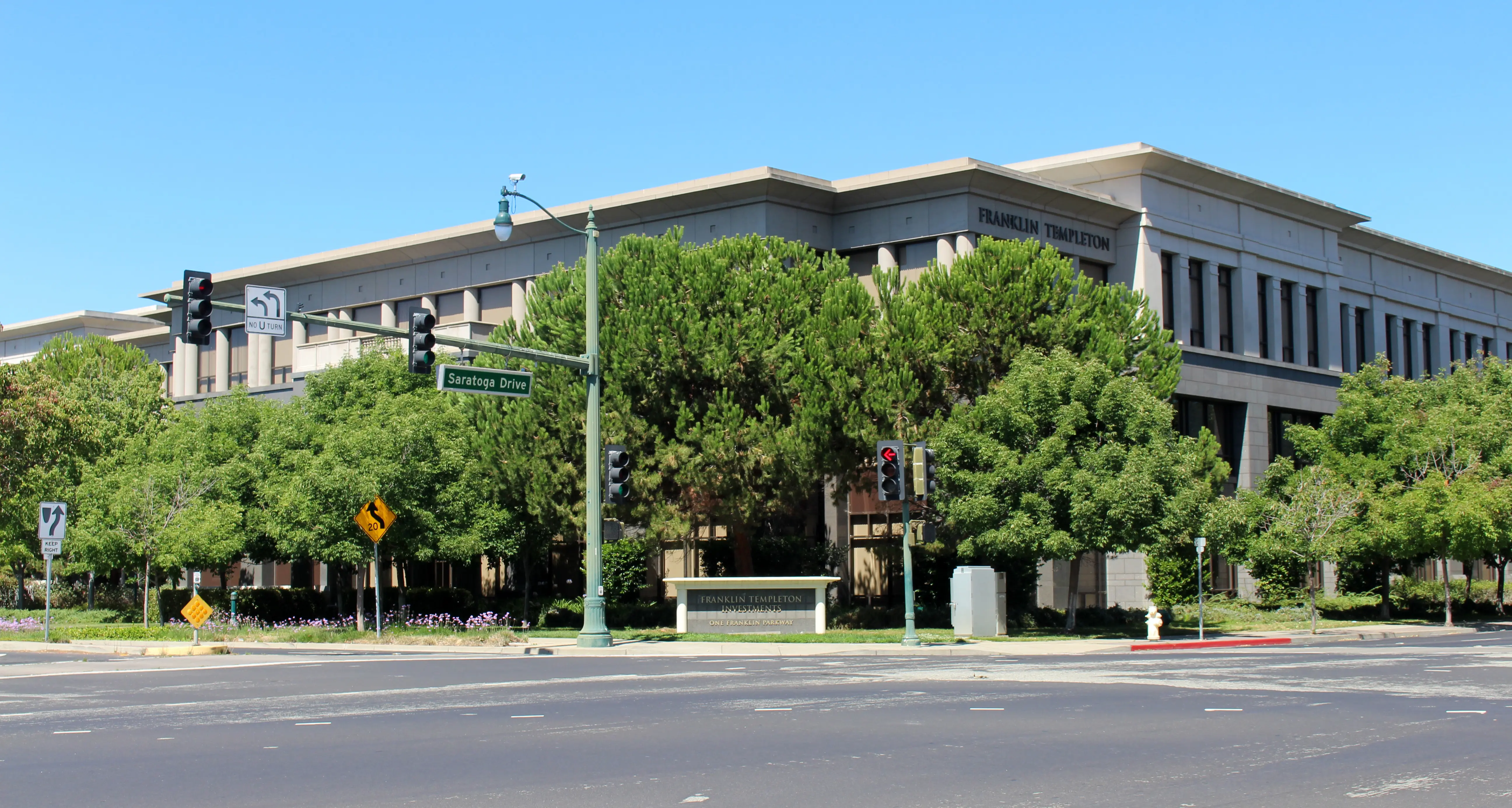 Franklin Templeton head office exterior with greenery and road signs in view
