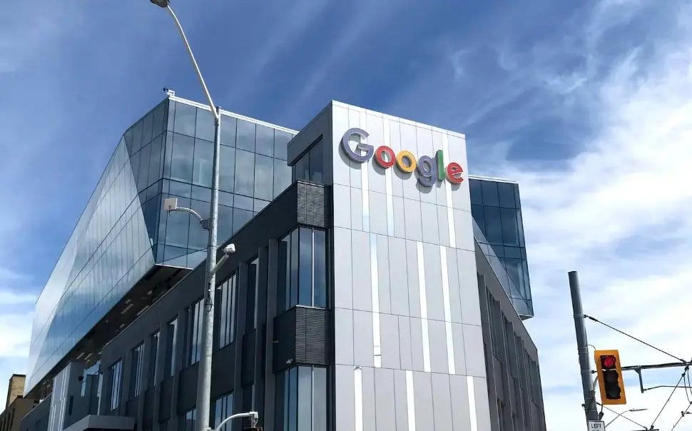 Google office building with logo visible on a sunny day.