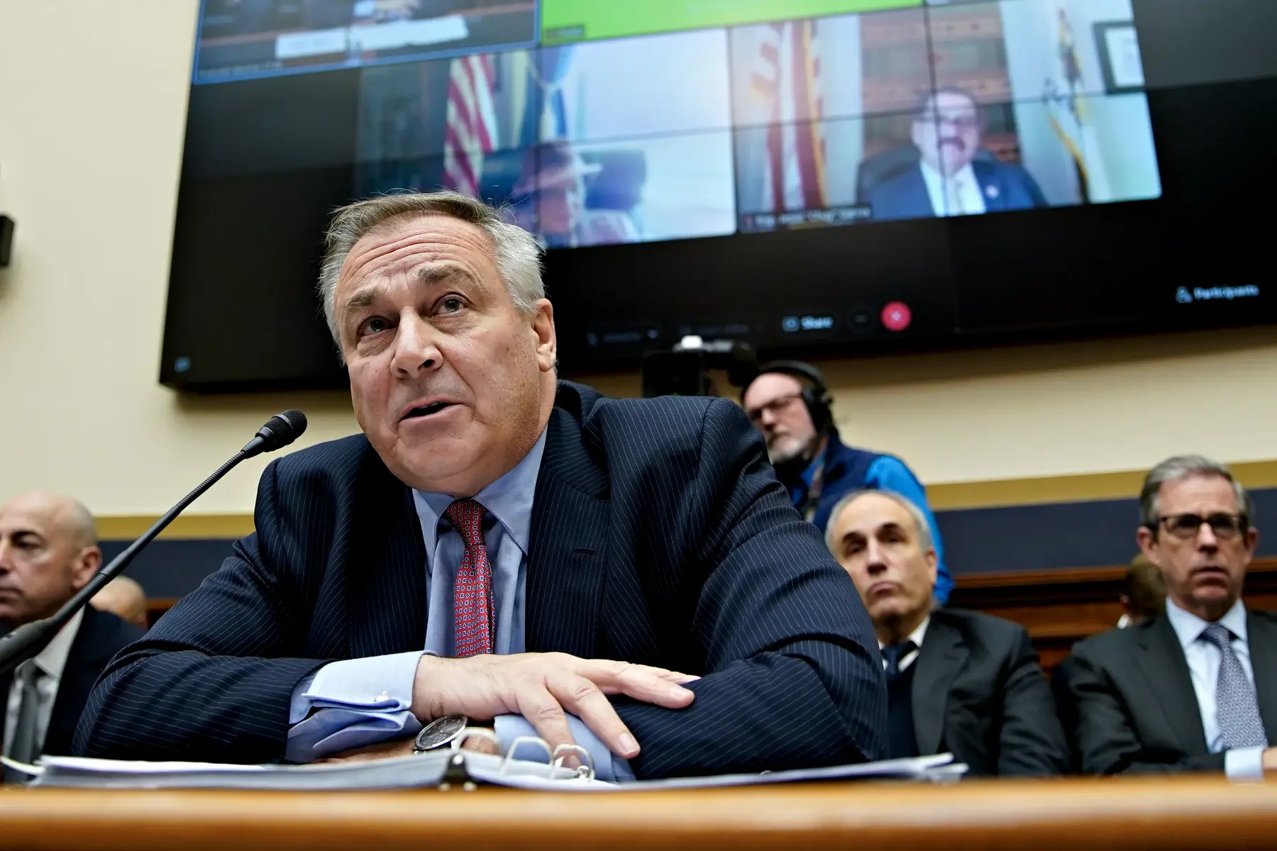 John J. Ray III testifies in front of a court during a hearing.