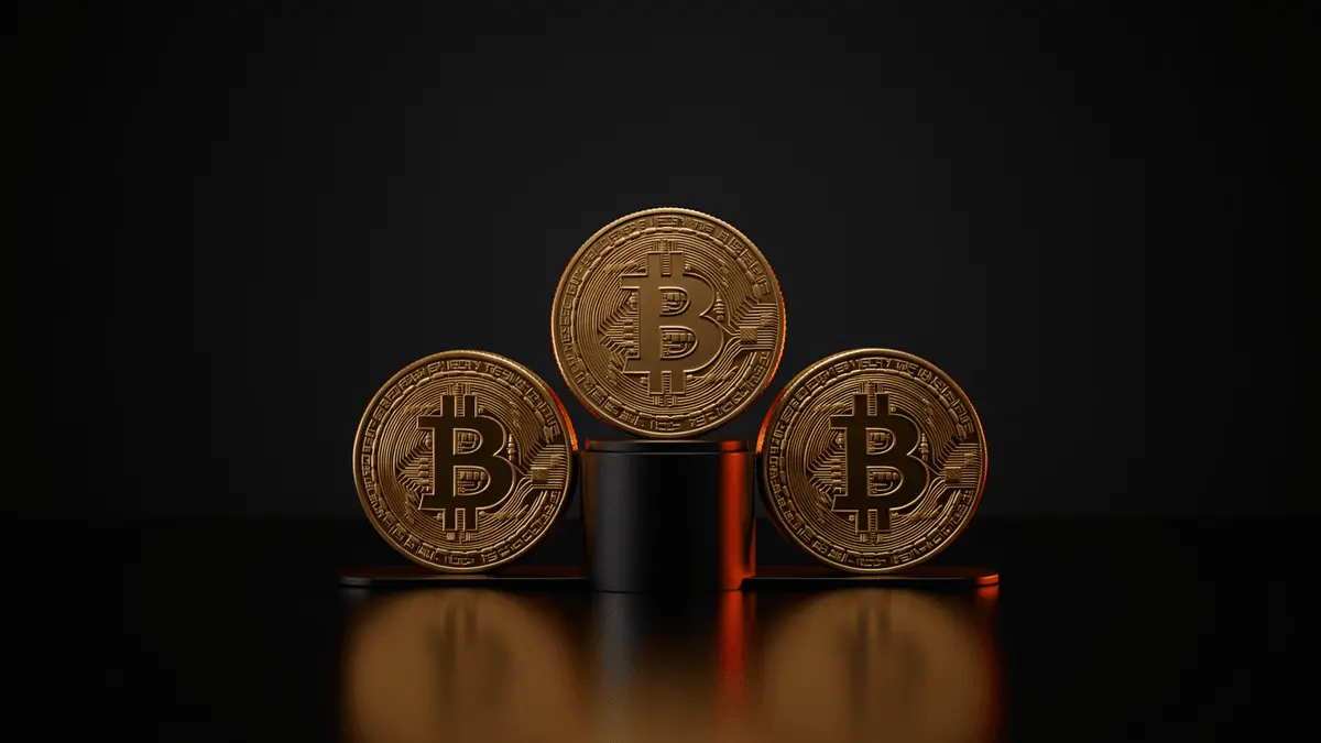 Gold Bitcoin coins arranged on podium representing corporate treasury ranking
