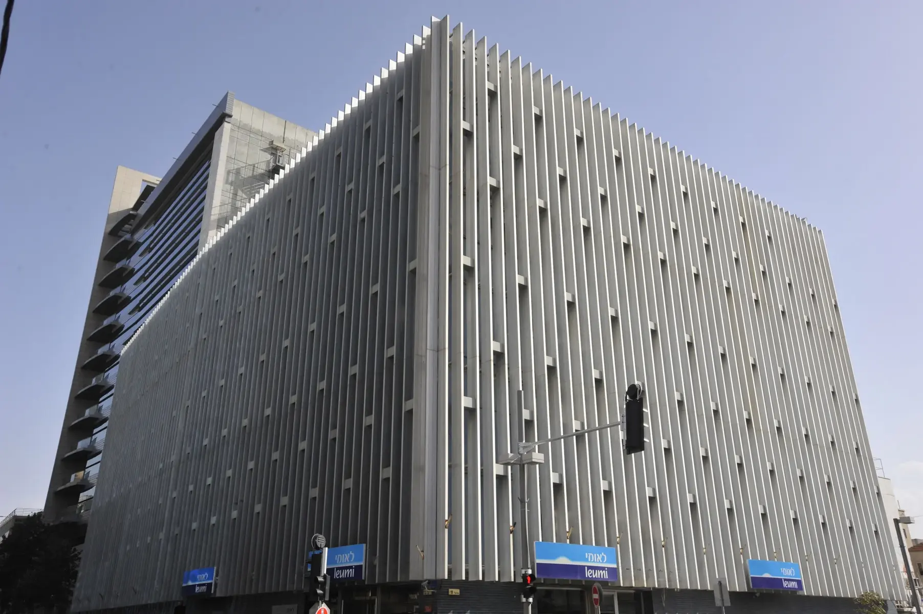 Exterior view of the Bank Leumi headquarters building in Tel Aviv featuring a distinct vertical ribbed facade