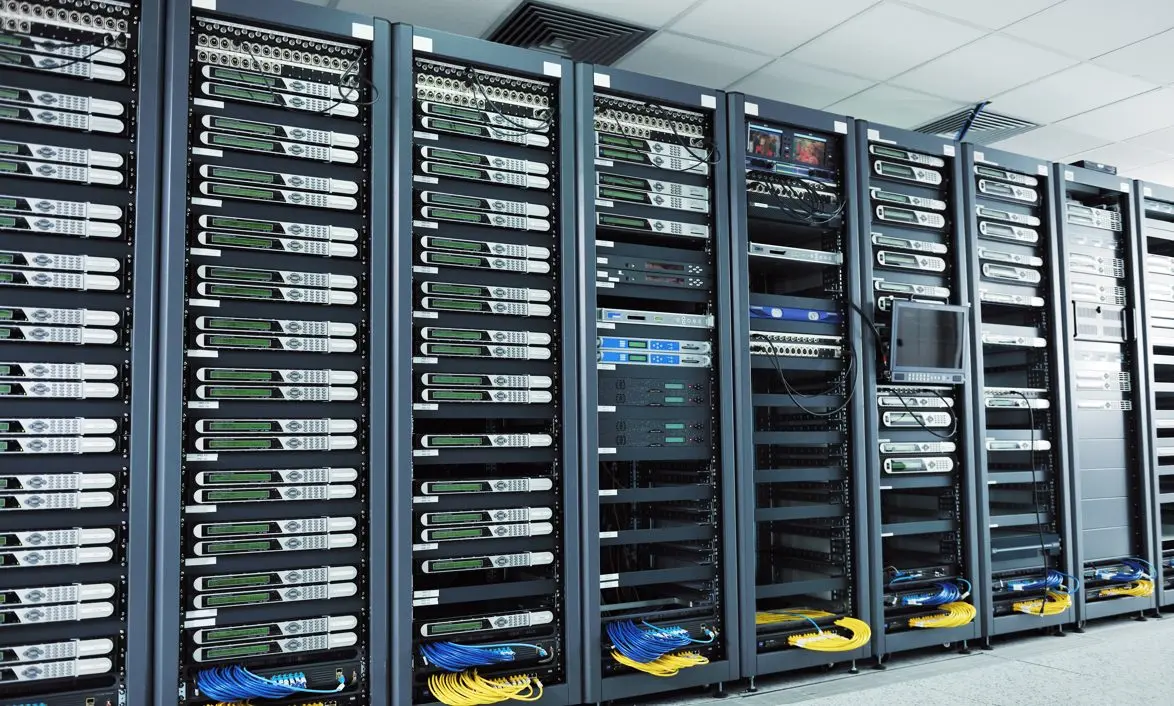 Rows of server racks with network switches and cabling in a professional data center