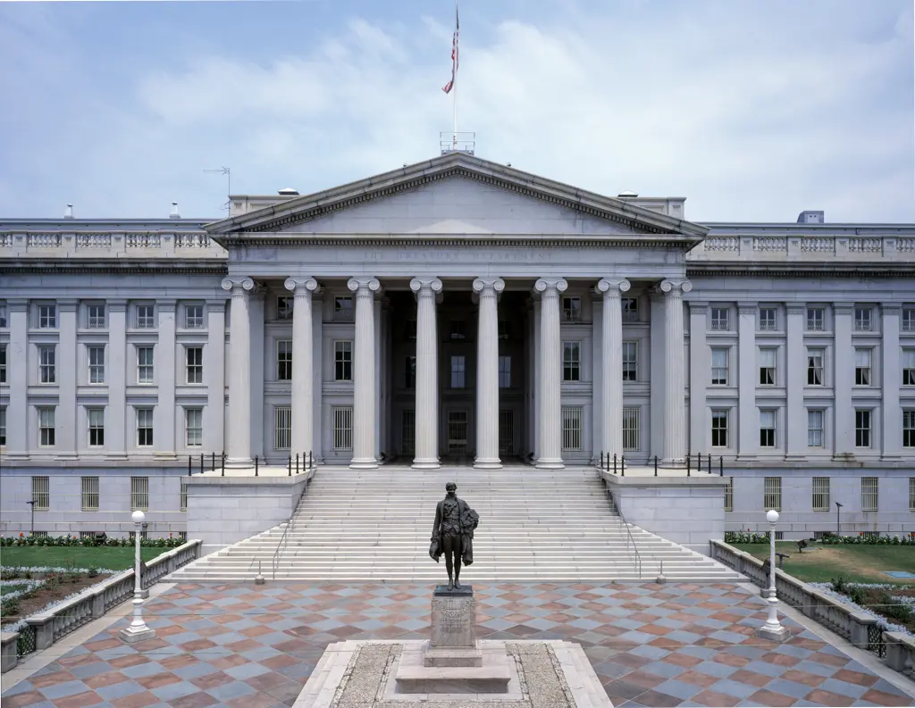 Front view of the US Department of the Treasury building in Washington D.C. with its neoclassical columns.