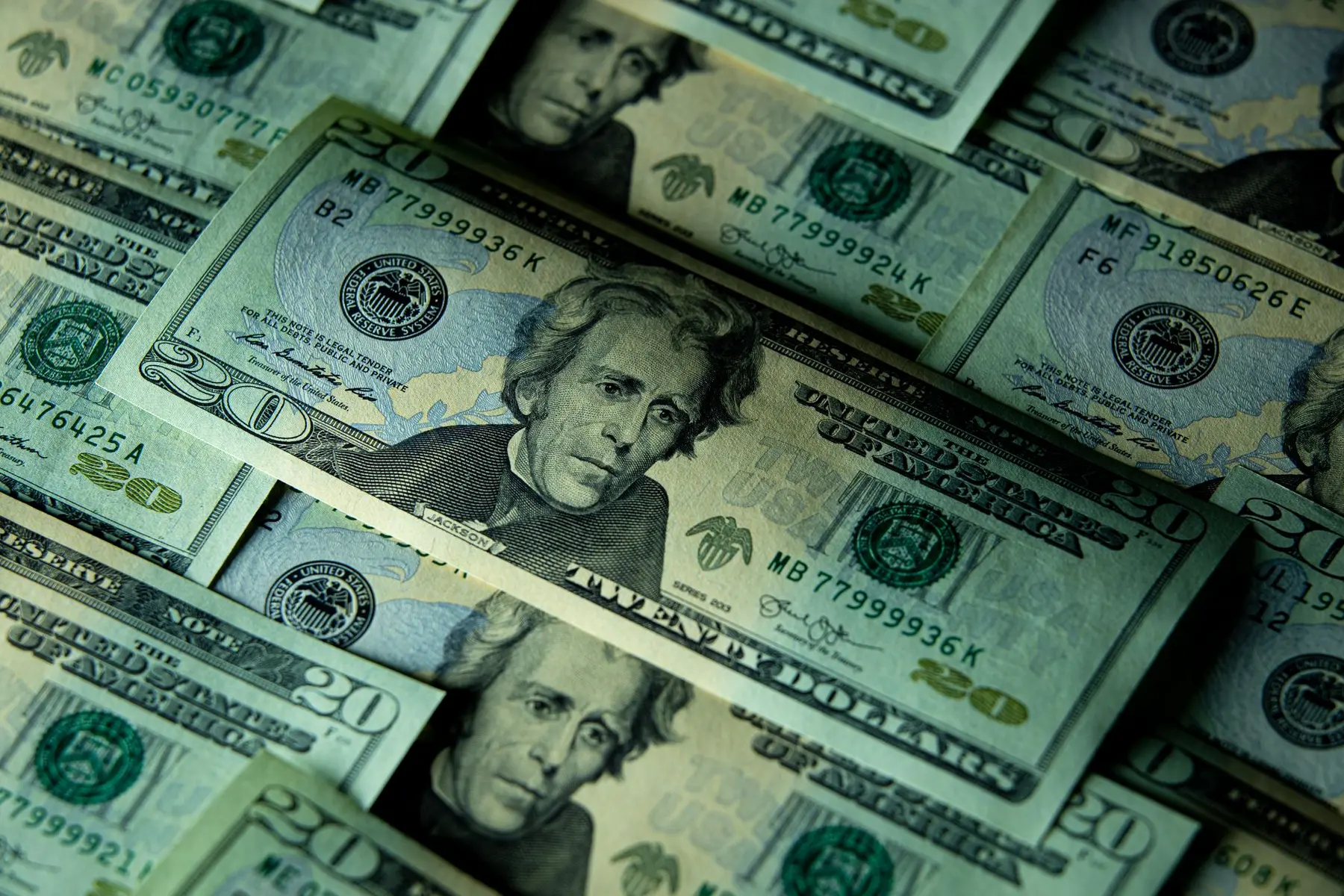 A close-up pile of United States twenty-dollar bills.