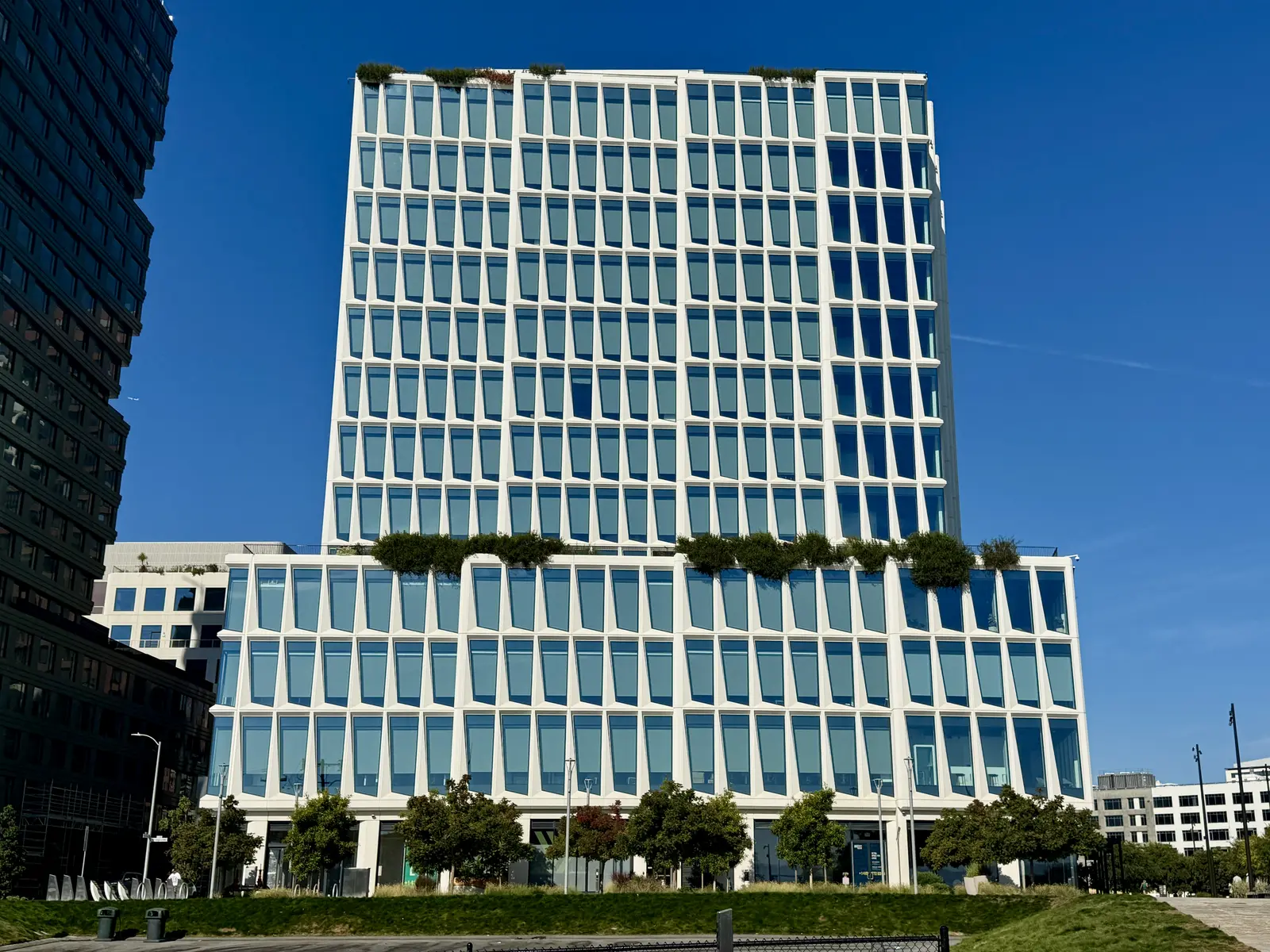 The exterior of the Visa headquarters building under a clear blue sky.