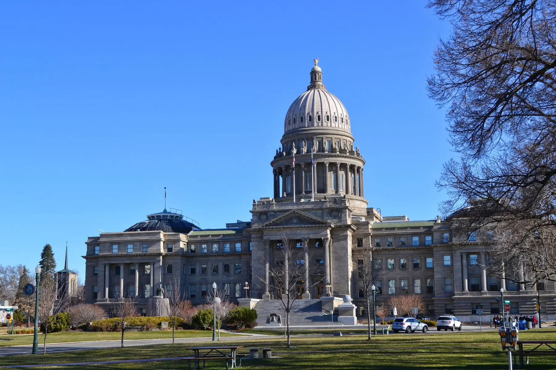 The Wyoming State Capitol building in Cheyenne with its prominent dome under a clear blue sky